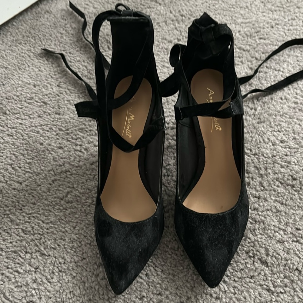 Lace up black suede stilettos. Four inch heels. Barely worn.